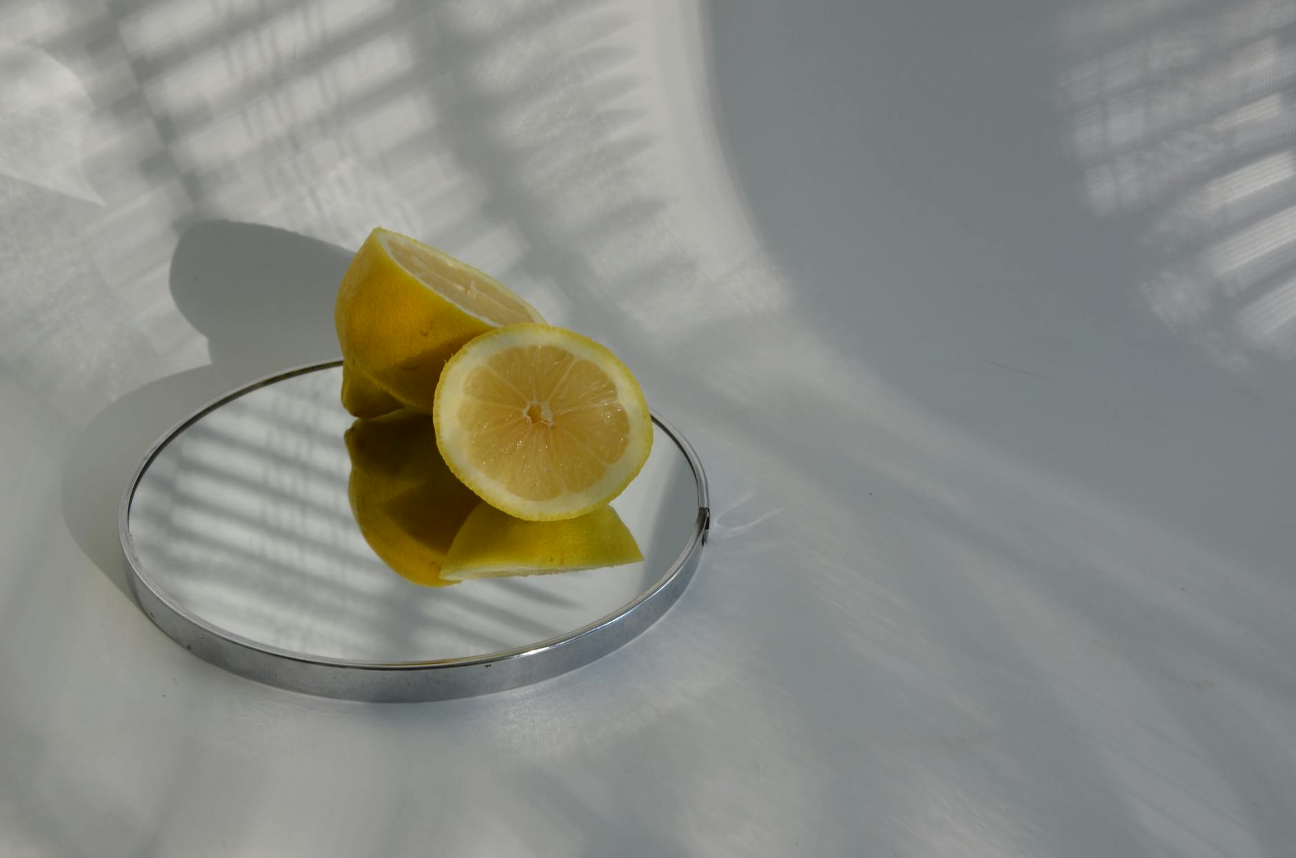 Close-up of fresh lemons held in cupped hands, symbolizing tenderness and sensitivity
