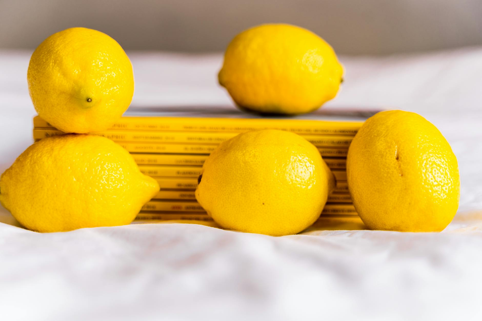 Yellow lemons arranged with books, symbolizing freshness and renewal during midlife changes